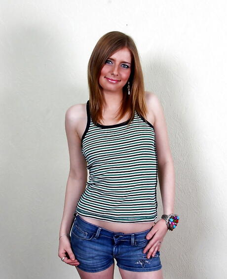 Slim babe Liona in fancy shorts showing small tits and masturbating 